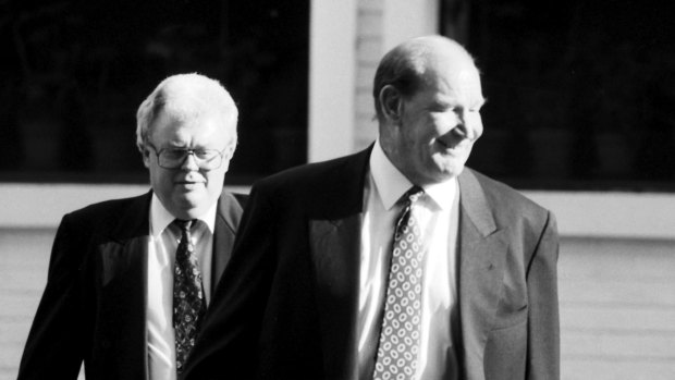 Media magnate Kerry Packer (right) leaves Mario's restaurant in East Sydney with Labor senator Graham Richardson on October 9, 1992. 