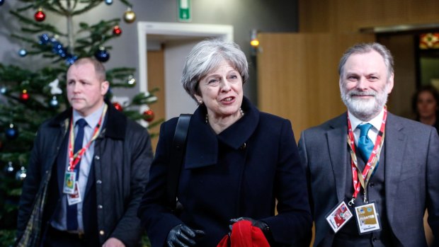UK Prime Minister Theresa May and the UK's permanent representative to the EU Tim Barrow, leave the EU leaders summit on Friday