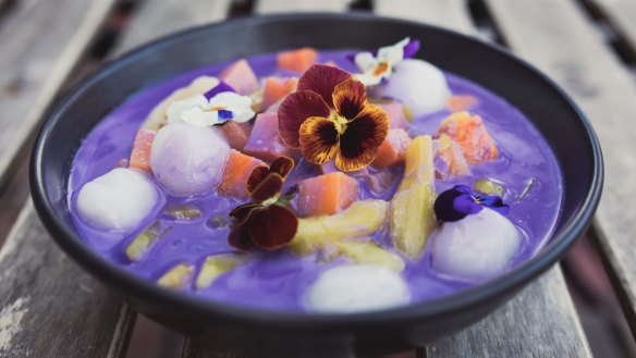 Ginataang halo-halo dessert: Warm purple yam and coconut sauce, glutinious rice balls, sago and jackfruit.