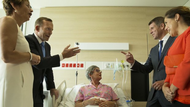 Mike Baird,  right, with his wife Kerryn and Tony Abbott, left, with his wife Margie visit breast cancer patient Lyn Harvey at the Chris O'Brien Lifehouse Hospital.