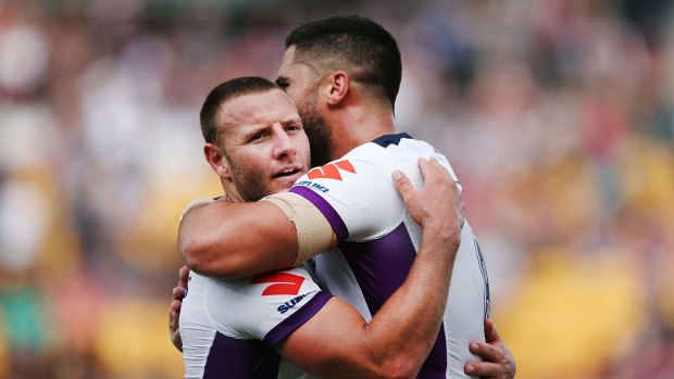 Celebrations: Blake Green embraces teammate Jesse Bromwich after winning their round three NRL match against the New Zealand Warriors.