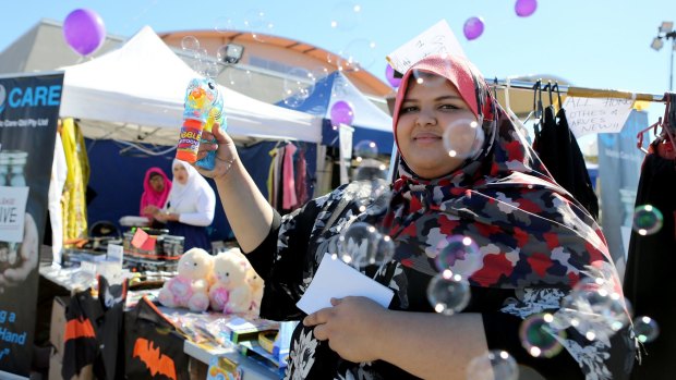 Aysha Mohd Ali with her bubble toy at the Eid Down Under Festival in Brisbane.