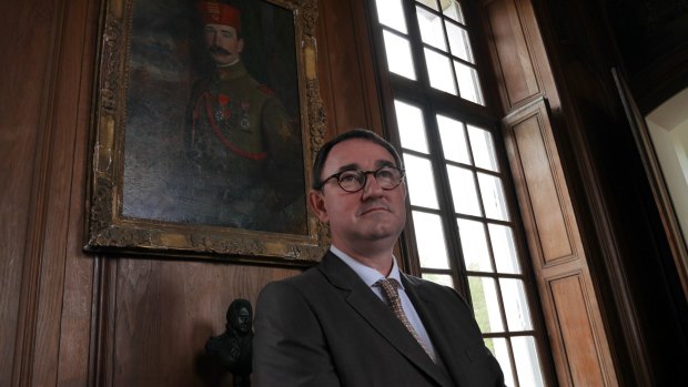 Monsieur Stanislas de Clermont-Tonerre poses next to a painting of his great-grandfather at Chateau Bertangles.