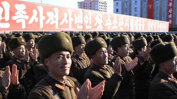 North Korean military personnel clap hands in a rally, after North Korea said it had conducted a hydrogen bomb test in January.