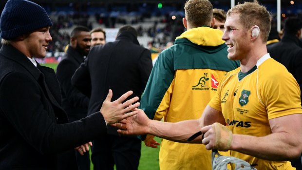 Job well done: Michael Hooper, left, congratulates David Pocock after the whistle at the Stade de France.