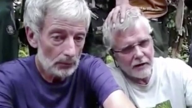 Philippine security forces have recovered the headless body of kidnapped Canadian Robert Hall (left).