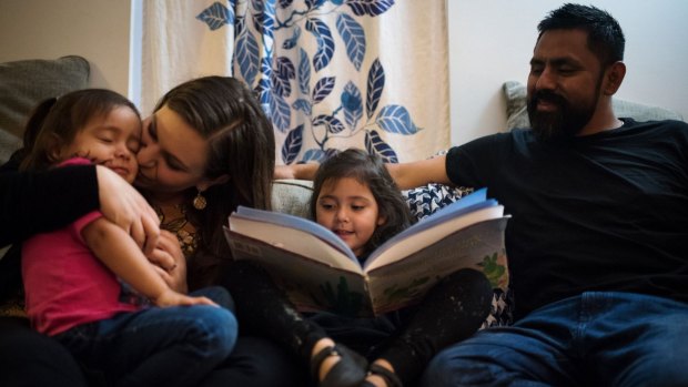 Rachel McCormick and her husband Irvi Cruz with their daughters Ana, 2, and Sara, 4, at their apartment in Harlem. Rachel is a US citizen; Irvi is not. They are struggling with where to live.