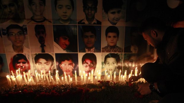 Sad times: A candelight vigil in Lahore for students killed in the school attack.