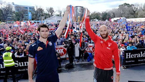 Bulldogs captains Easton Wood and the Swans' Jarod McVeigh hold the premiership cup.