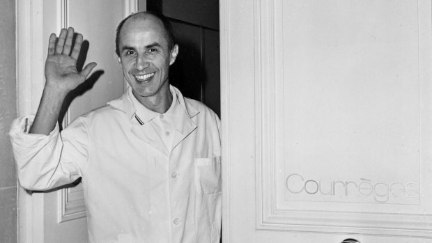 Andre Courreges, waving at the door of his fashion house in Paris in 1967.