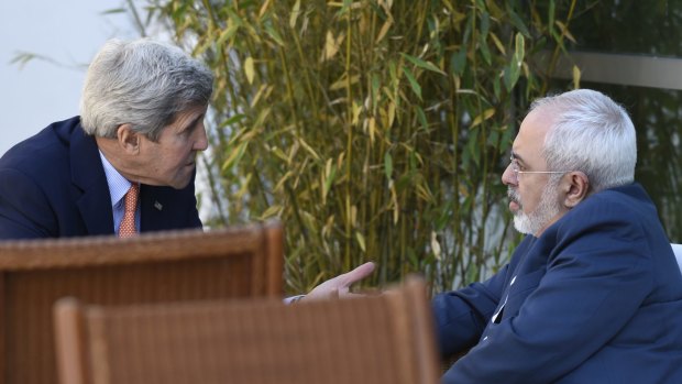 US Secretary of State John Kerry, left, talks with Iranian Foreign Minister Mohammad Javad Zarif in Geneva on Saturday.