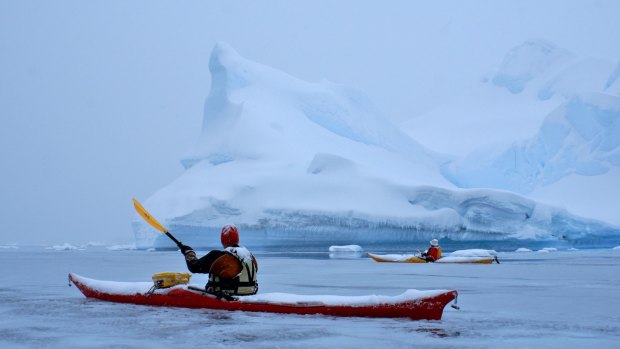 Kayaking in icy waters.