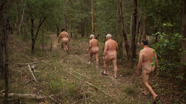 Members of the Campbelltown Heritage Nudist Club take a nature walk au naturel on their property at Minto Heights.