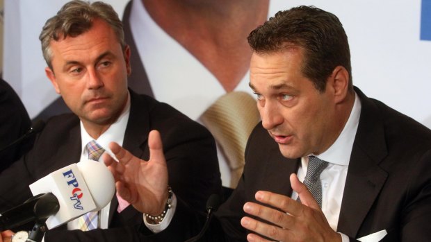 Norbert Hofer, left, who lost the election in Austria, and Heinz-Christian Strache, head of Austria's Freedom Party, talk to the press in Vienna on Tuesday. 