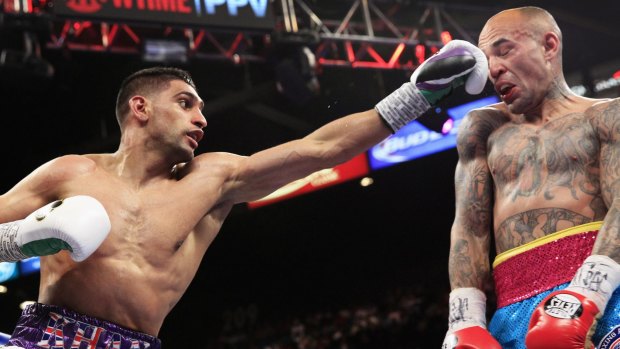 Leading with the left: Amir Khan of Britain, left, punches Luis Collazo.