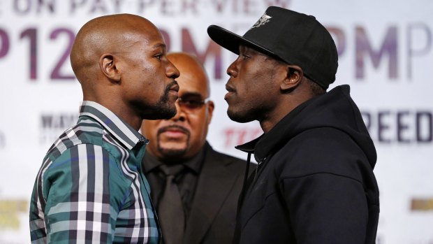 Boxers Floyd Mayweather jnr (left) and Andre Berto pose during a news conference.