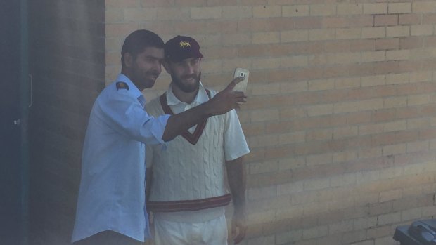 Smiling assassin: Glenn Maxwell poses with a fan on Saturday.