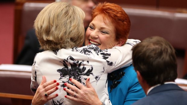 Senator Michaelia Cash hugs Senator Pauline Hanson after her first speech to the Senate in September.