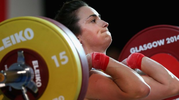 Former beauty queen Sarah Davies competes in the weightlifting.