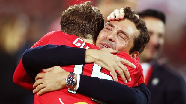 Top dogs: Adelaide United head coach Guillermo Amor celebrates with Craig Goodwin after the A-League grand final.
