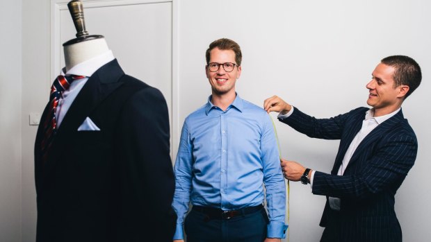 Institchu co-founder James Wakefield measures up John Mason in the new Canberra store.