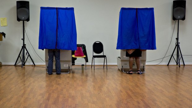 Residents use an electronic voting machine at a polling location in Philadelphia, Pennsylvania, US.