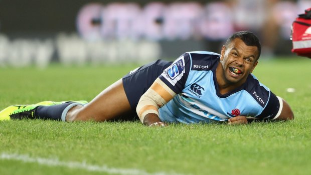 Devastating blow: Kurtley Beale looks to the sideline after injuring his knee.