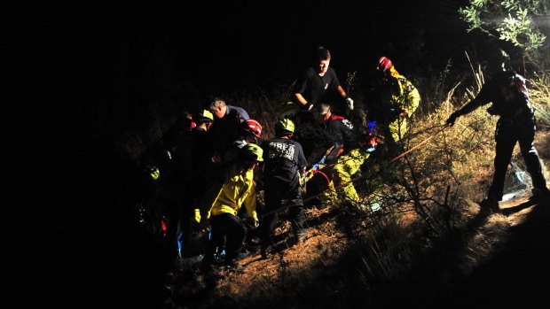 ACT Fire and Rescue crews work to rescue a 17-year-old boy at Ginninderra Falls. 