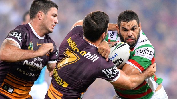 GI go: Greg Inglis takes on Ben Hunt and Matt Gillett.