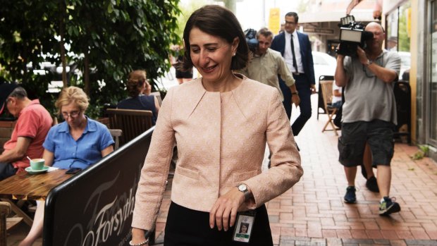 Gladys Berejiklian walks to her press conference this morning.