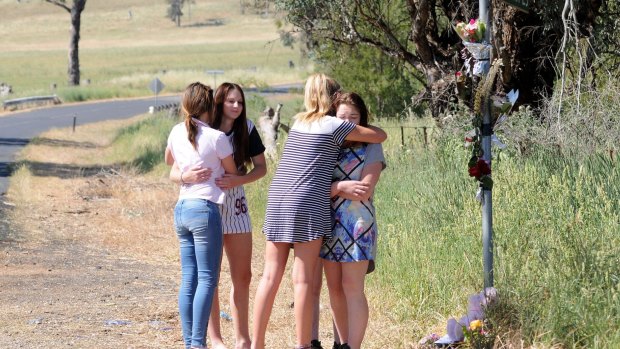 Friends gather at the crash site where Sevanah Lang and her mother Kelly Landers died.