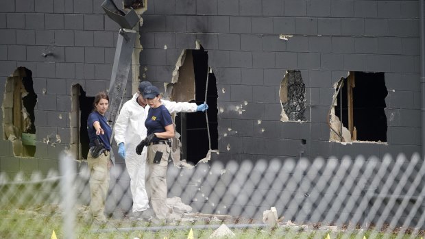 Huge holes were blown out of the side of the nightclub by police in the shooting. 