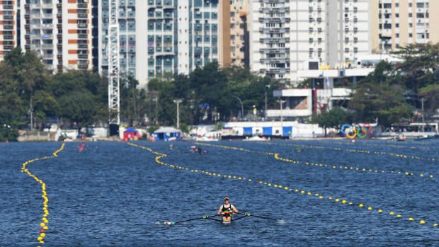 The wind blows the rowing lane ropes out of position after racing is cancelled.