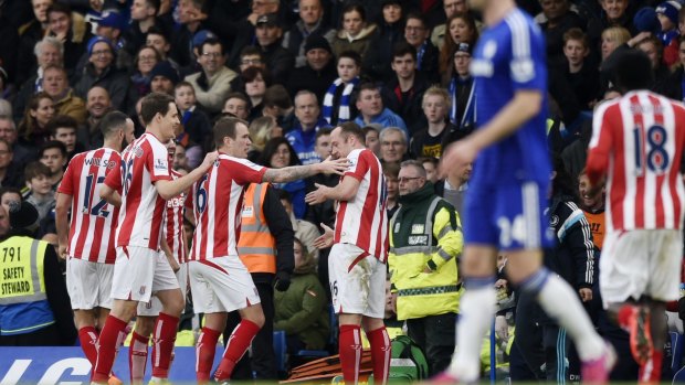 Charlie Adam celebrates with team mates after scoring from his team's side of halfway.