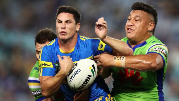 Frustrating start: Mitchell Moses spills the ball under pressure against the Raiders.