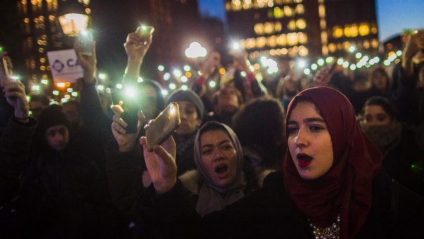 At Washington Square Park in New York, Muslim women shout slogans during a rally against President Donald Trump's order which aims to crack down on immigrants living in the US.