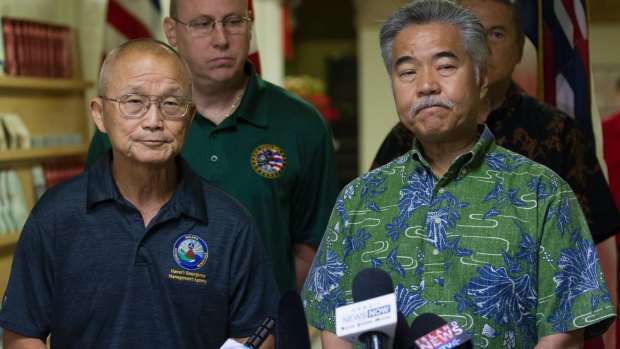 HEMA administrator Vern Miyagi, left, and Hawaii Governor David Ige address the media at the Hawaii Emergency Management Centre after the false alarm.