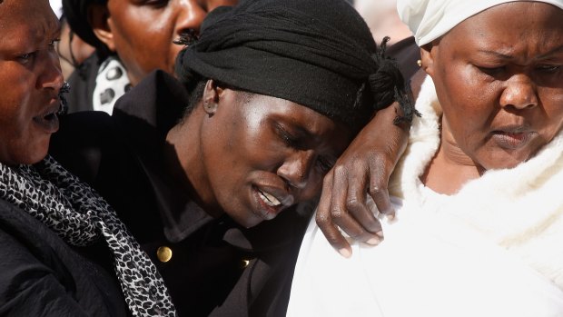 Akon Guode at the funeral of her three children last year.