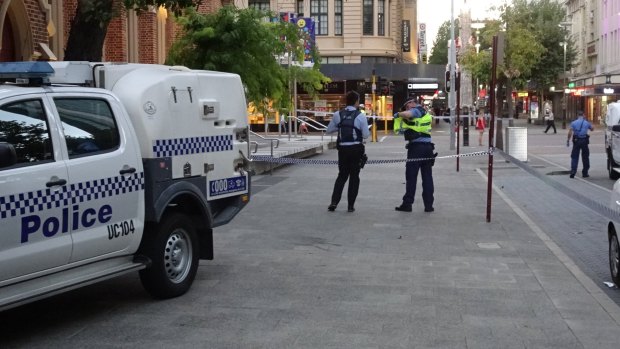 Police cordoned off the area outside Wesley Church on Tuesday. 