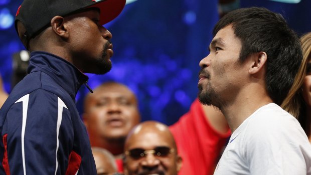 Floyd Mayweather and Manny Pacquiao  at the wiegh-in for the title bout.