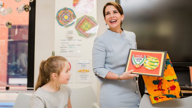 HRH Princess Haya Bint Al Hussein receiving World Cup football-inspired gifts made by young patients.