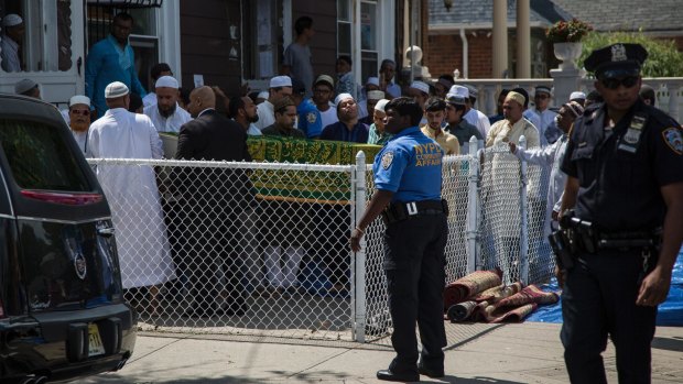 Family and members of Al-Furqan Jame Masjid mosque gather for Salat al-Janazah, an Islamic funeral prayer, for slain imam Alauddin Akonjee in New York.