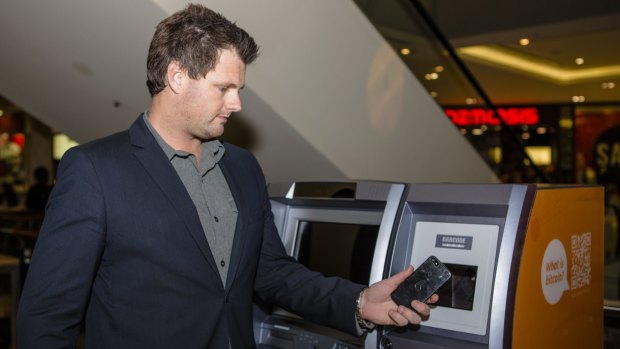Australian Bitcoin ATMs director Robert Masters uses Canberra's first Two-Way Bitcoin ATM at Canberra Centre. Photo by: Jamila Toderas