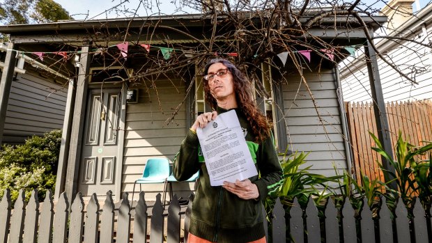 Lucie Spectre in front of a house on Bendigo Street.