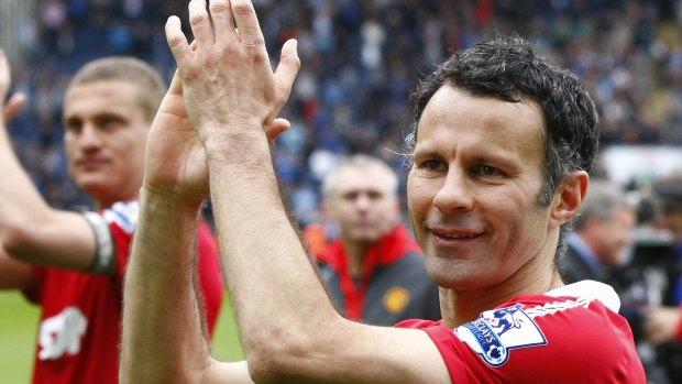 Ryan Giggs, pictured in 2011,  celebrating after Manchester United won the English Premier League.