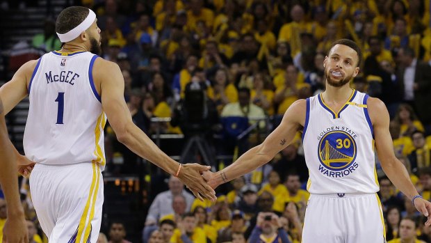 Golden child: Warriors star Steph Curry (right) celebrates during Golden State's first matchup of the 2017 playoffs.