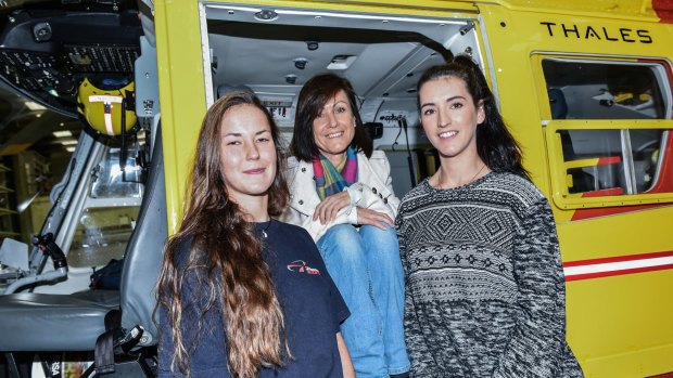 Bond: Rescue crew officer Samantha Law (left) with Margo Murphy and Stephanie Murphy.
