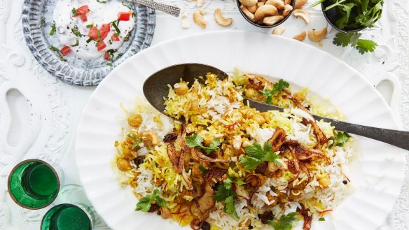 Chickpea biryani topped with crispy onions and cashews.