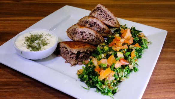 Kibbeh sagiah (spiced lamb kibbeh) with tabbouleh.