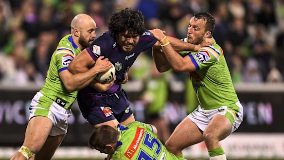Green wall: Tohu Harris takes on the Canberra Raiders at GIO Stadium.